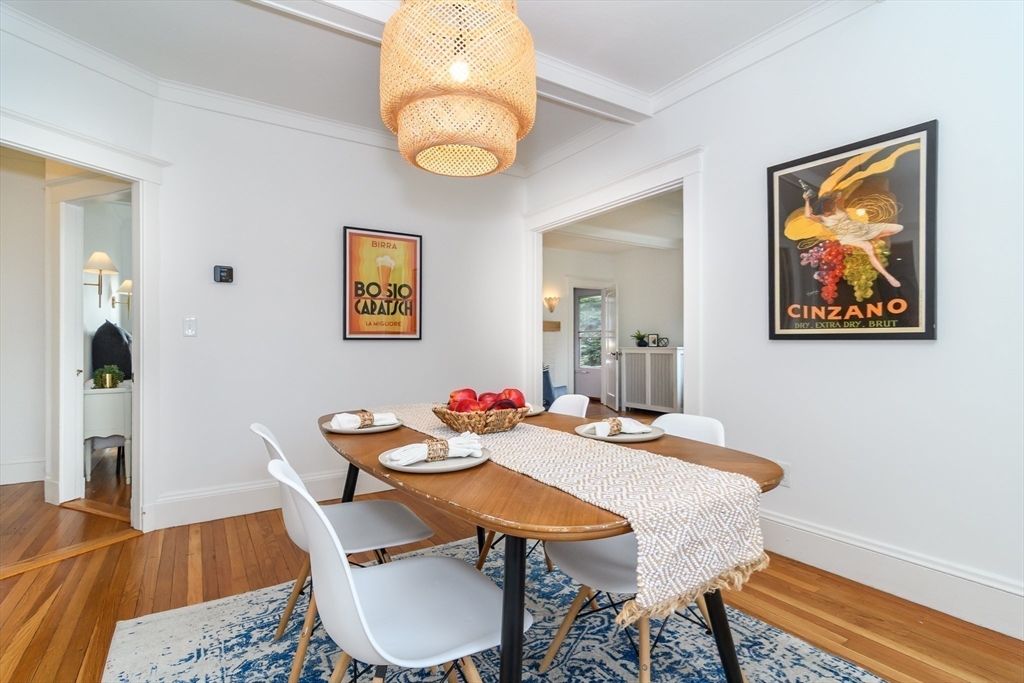 32 Harvard Street Natick, MA 01760 - Photo 9 of 24 a view of a dining room with furniture and wooden floor