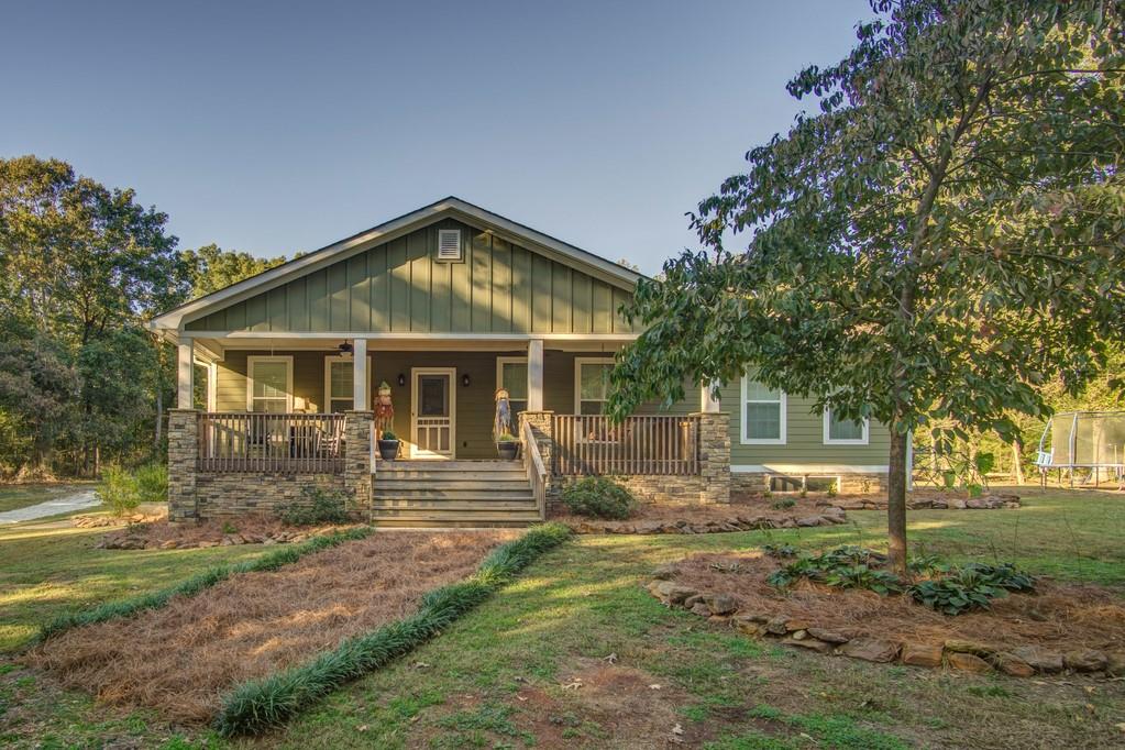 765 Omer Bond Road Royston, GA 30662 - Photo 1 of 1 a front view of a house with garden