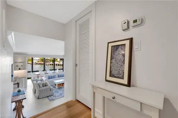 a spacious bedroom with a bed and large windows