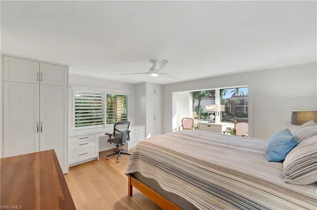a bedroom with furniture and a window