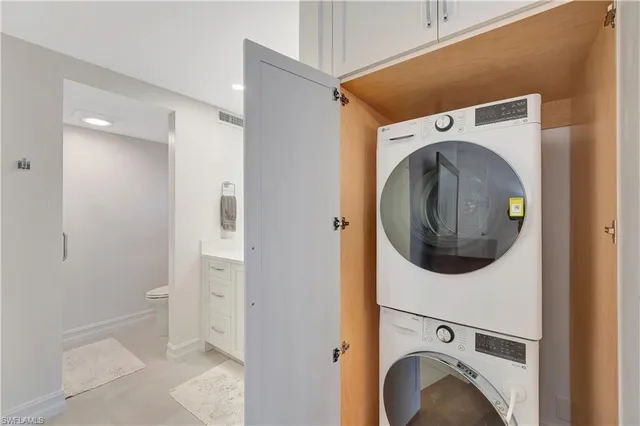 a bedroom with a bed and a table in it with window