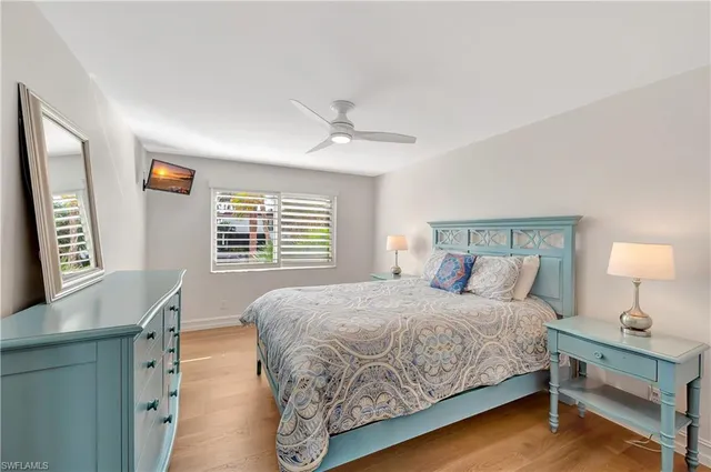 a bedroom with a large bed and a dresser