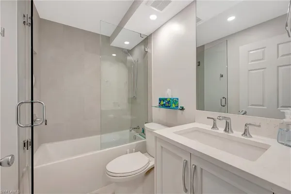 a view of hallway with a large window and stairs