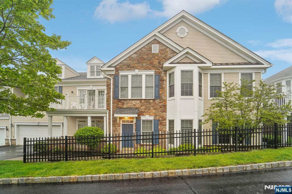 50 Talus Road, Unit 5706 Woodland Park, NJ 07013 - Photo 1 of 33 a front view of a house with a yard