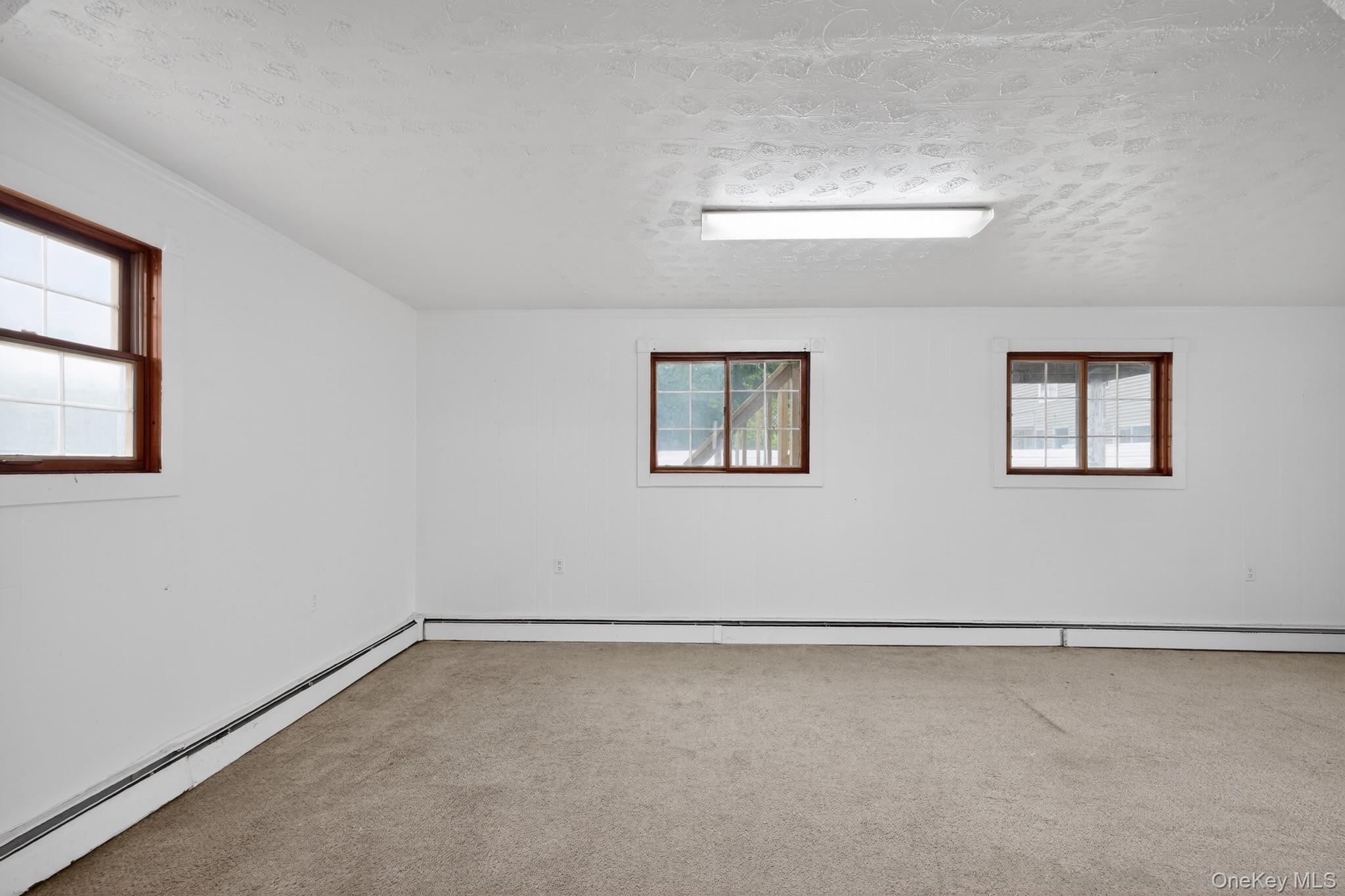 138 Spring Street Massapequa, NY 11758 - Photo 21 of 45 a view of a room with windows