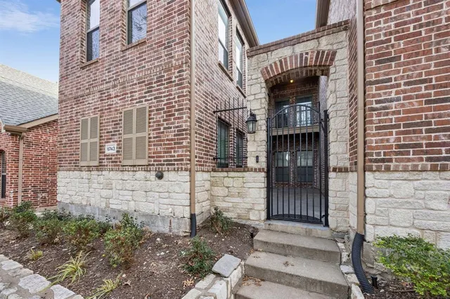 a brick building with a white door