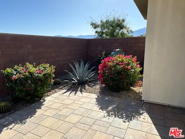 a view of balcony with furniture