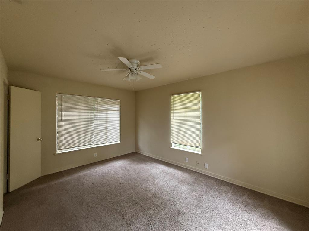 4748 South Ridge Terrace Fort Worth, TX 76133 - Photo 11 of 15 an empty room with windows and closet