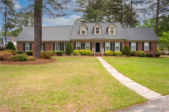 a front view of a building with garden