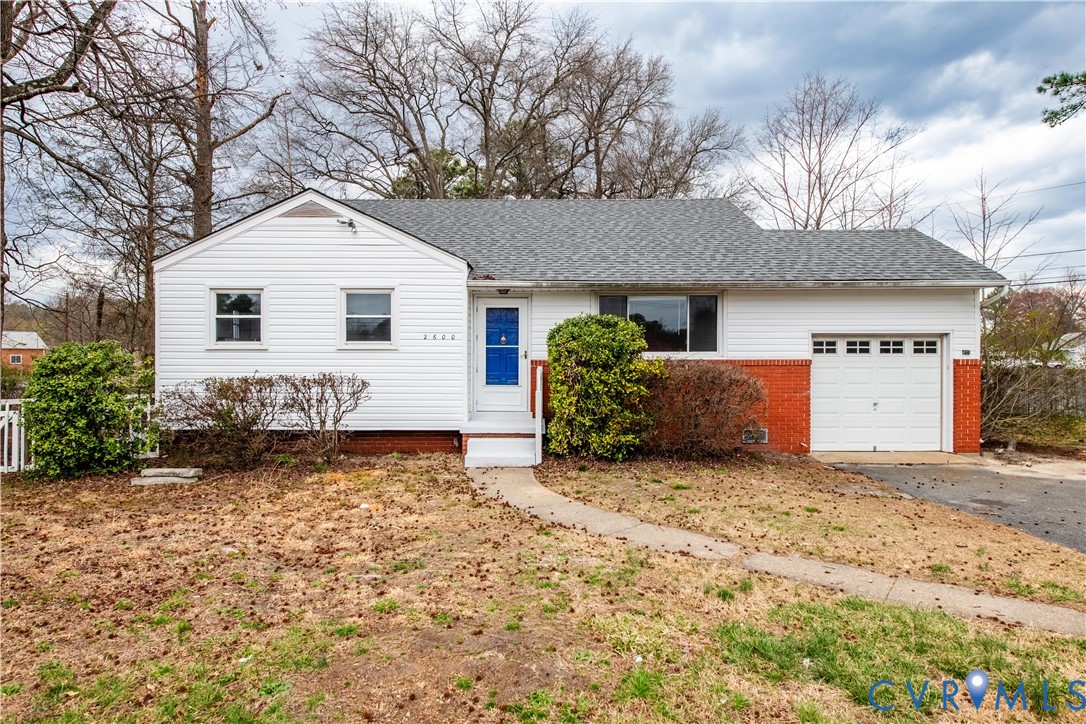 2600 Hungary Road Henrico, VA 23228 - Photo 1 of 43 a front view of a house with a yard