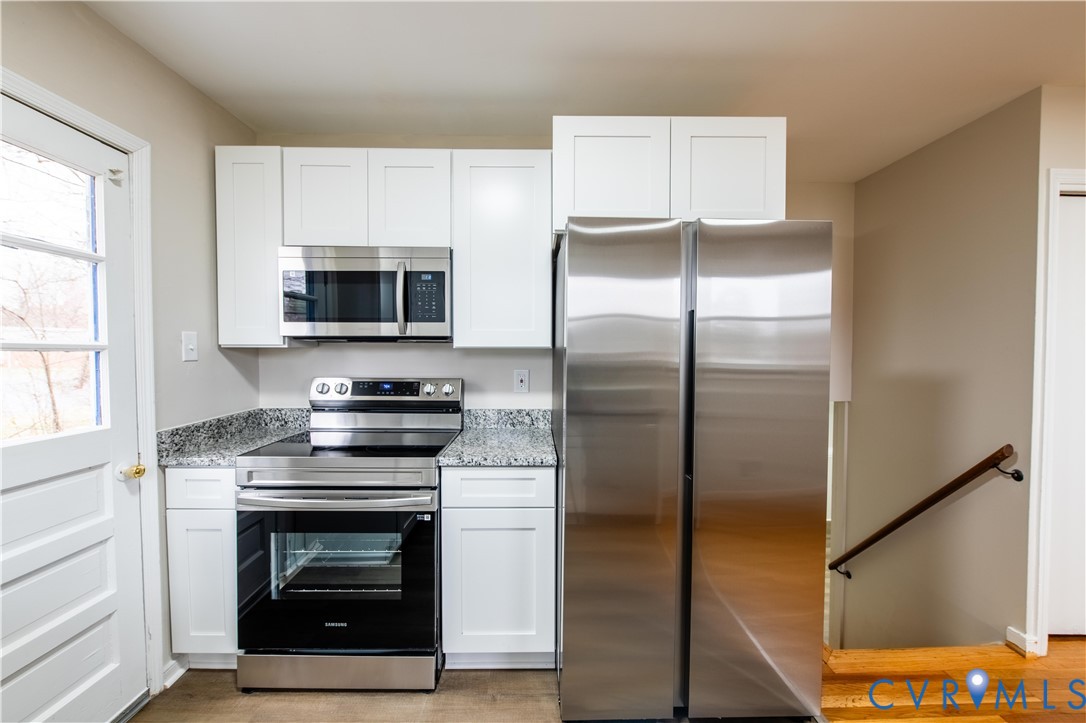 2600 Hungary Road Henrico, VA 23228 - Photo 16 of 43 a kitchen with a refrigerator stove and microwave