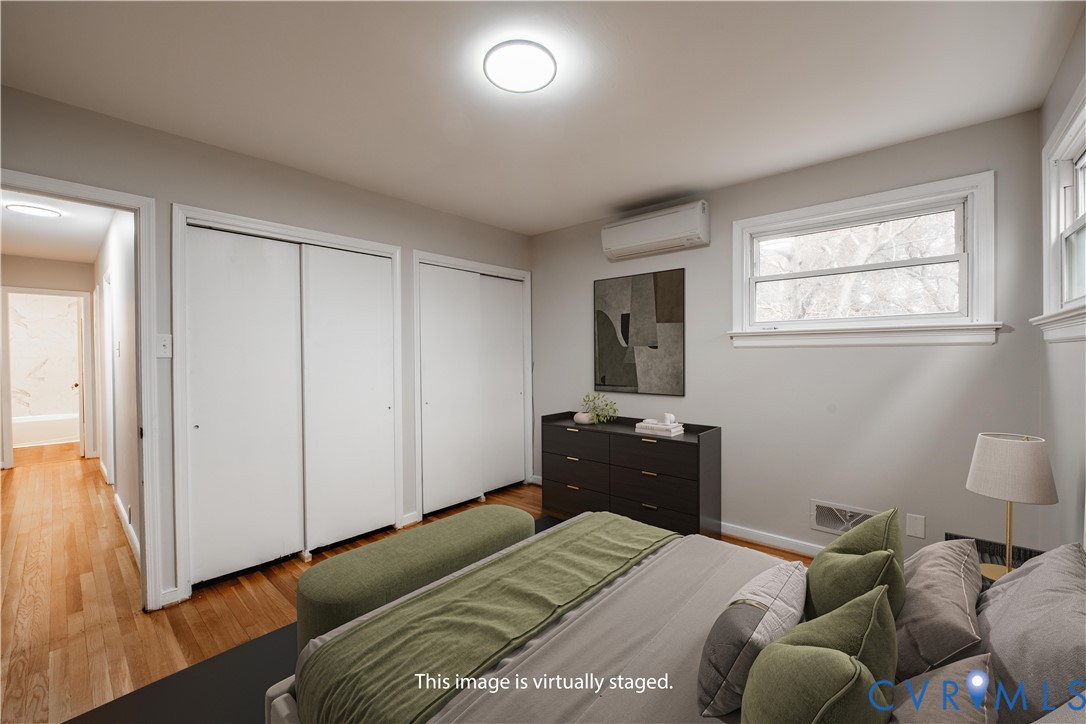 2600 Hungary Road Henrico, VA 23228 - Photo 24 of 43 a bedroom with a bed and wooden floor