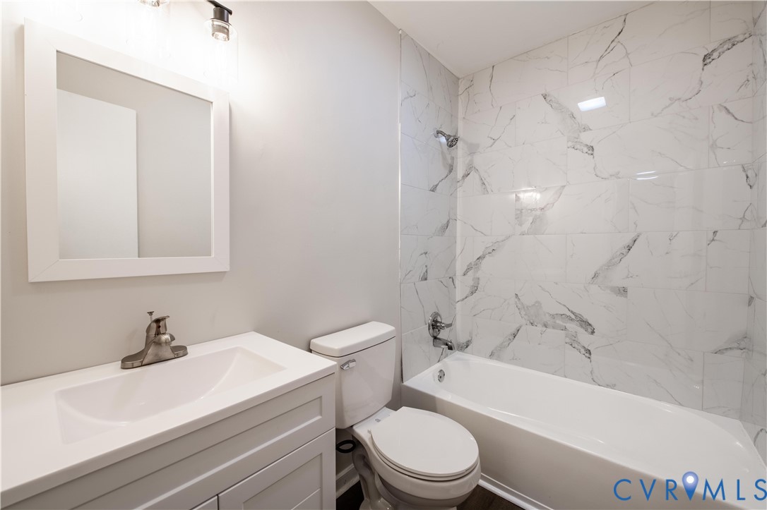 2600 Hungary Road Henrico, VA 23228 - Photo 34 of 43 a bathroom with a sink a toilet and a bathtub