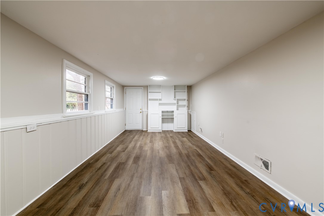 2600 Hungary Road Henrico, VA 23228 - Photo 38 of 43 a view of empty room with wooden floor and window