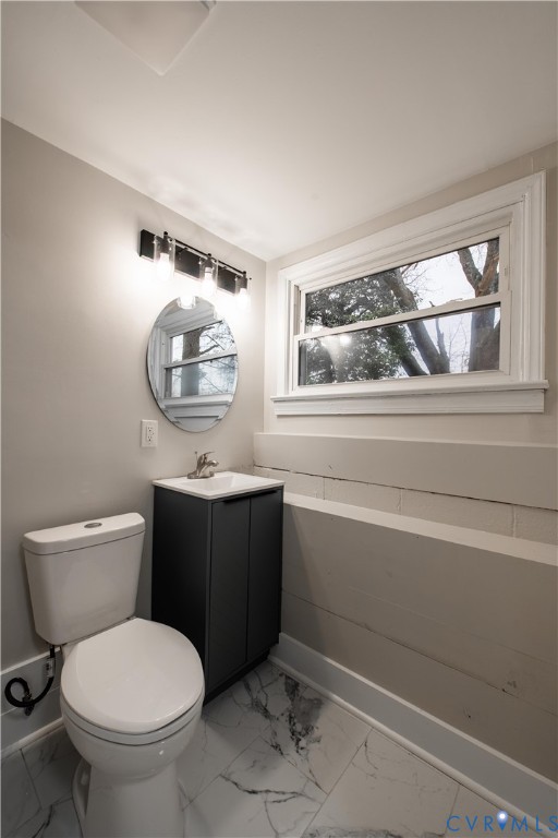 2600 Hungary Road Henrico, VA 23228 - Photo 40 of 43 a bathroom with a toilet a sink and mirror