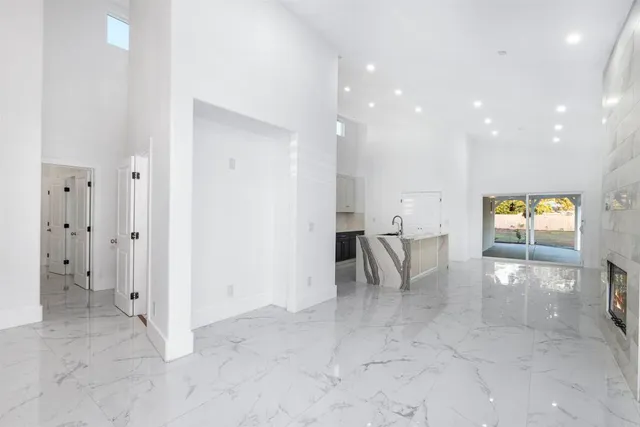 an entryway and dining room with furniture