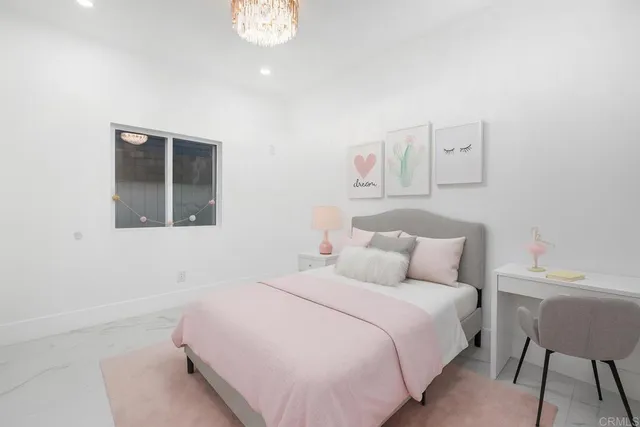 a bedroom with a bed and a chair