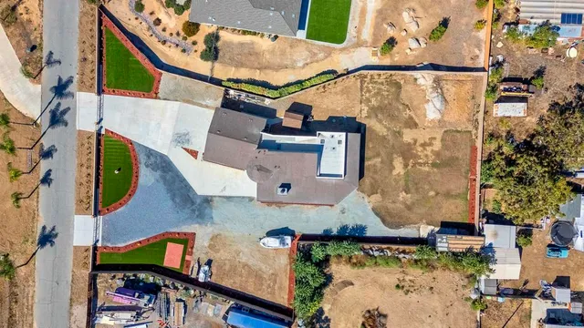 an aerial view of a house with a swimming pool