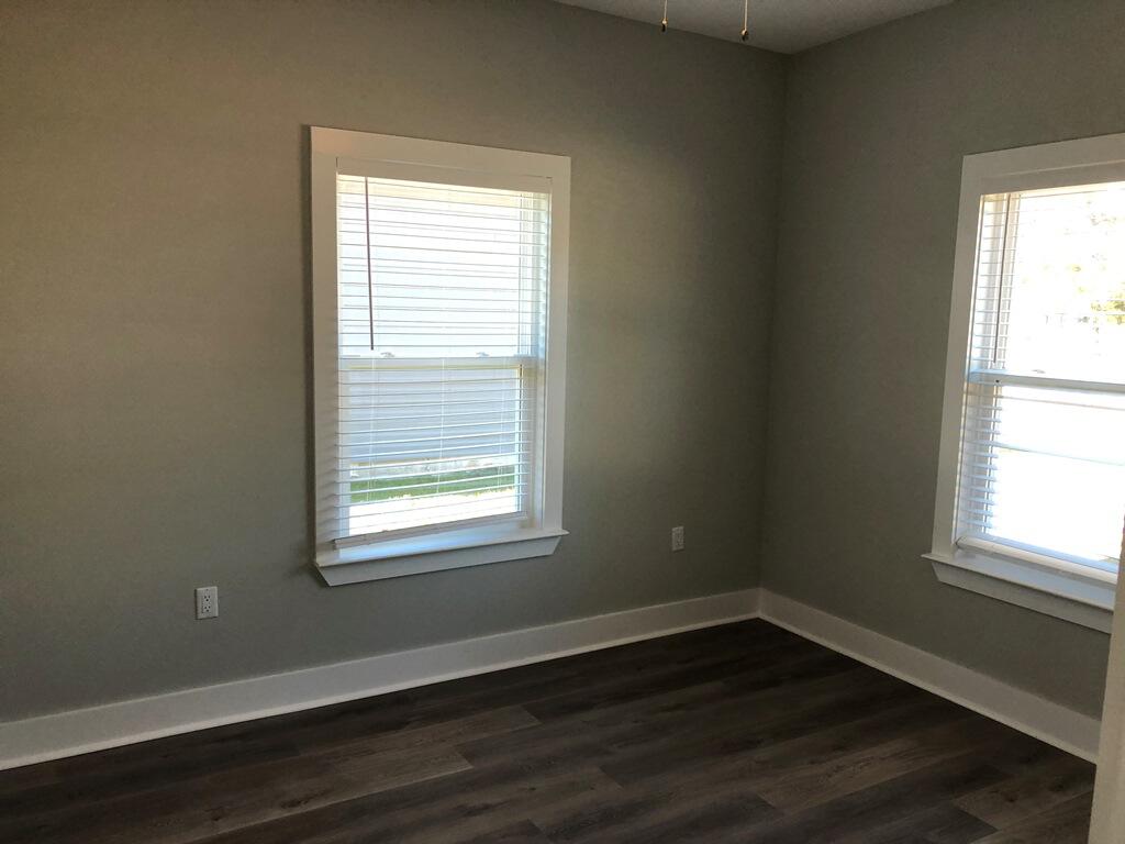 52 Magnolia Street Niceville, FL 32578 - Photo 14 of 16 an empty room with wooden closet and a window