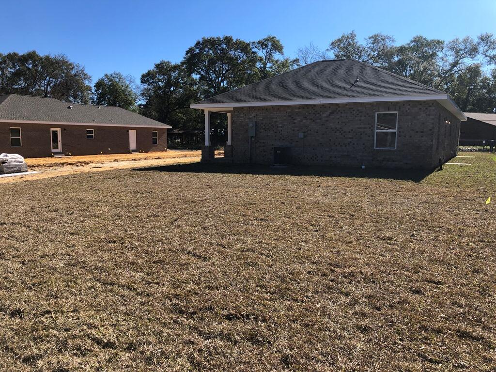 52 Magnolia Street Niceville, FL 32578 - Photo 16 of 16 front view of a house with a yard
