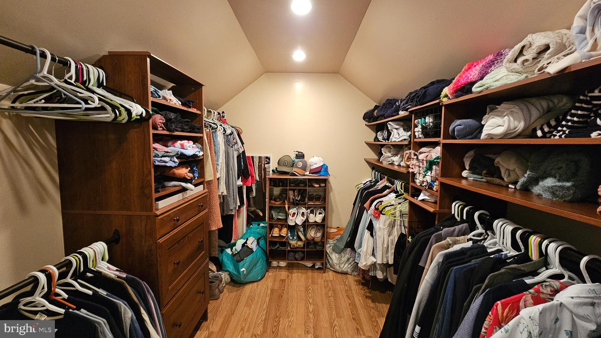 4021 Laurel Road Alexandria, VA 22309 - Photo 17 of 31 a view of walk in closet with clothes and shoes