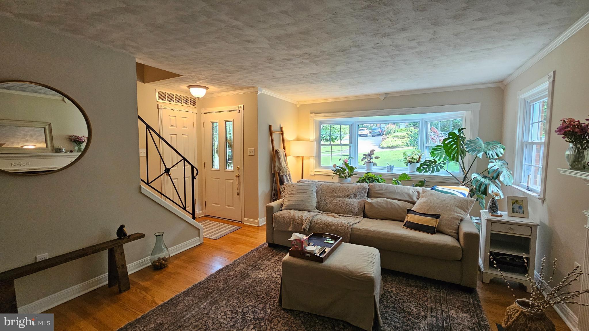 4021 Laurel Road Alexandria, VA 22309 - Photo 4 of 31 a living room with furniture and a floor to ceiling window