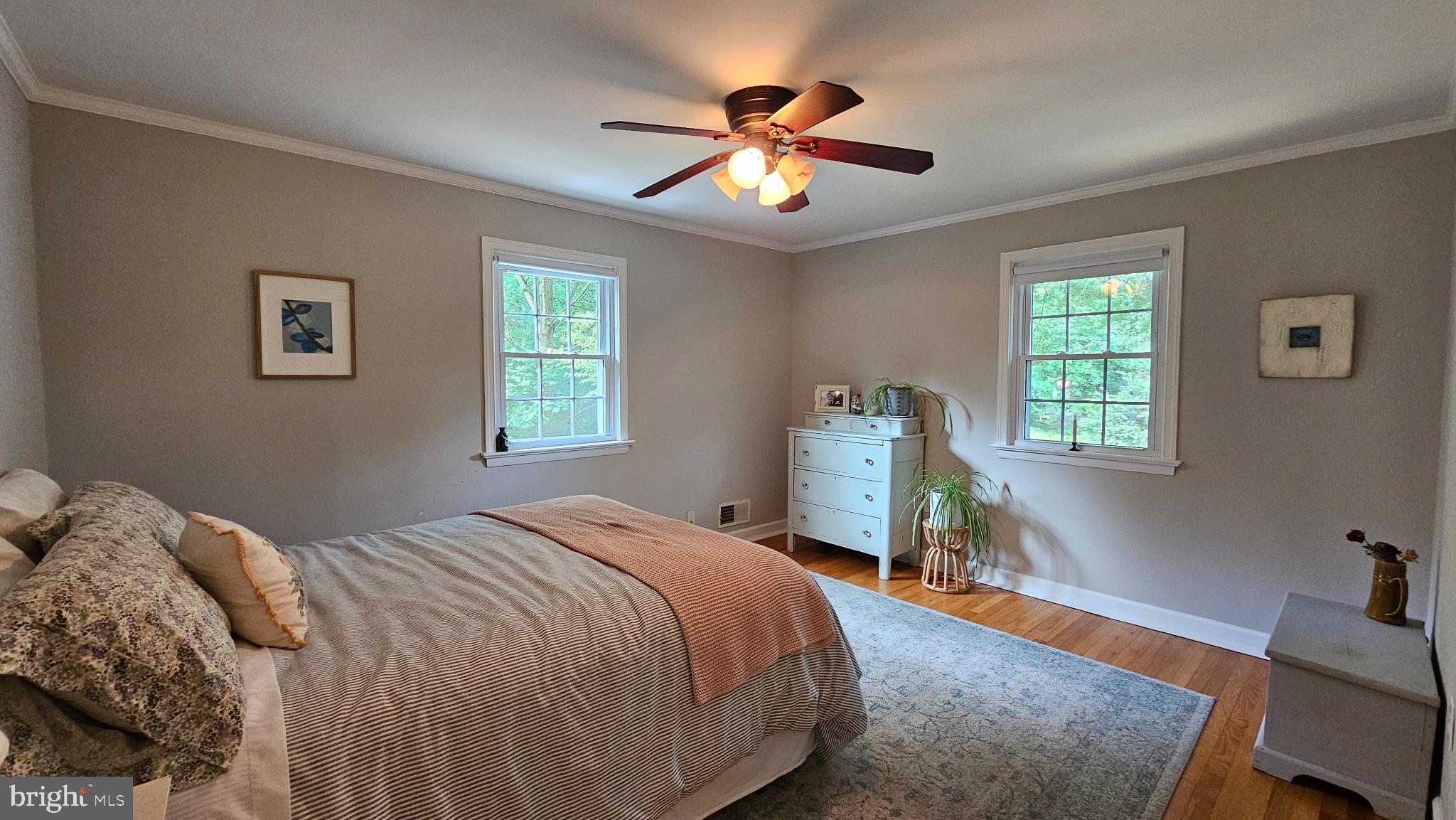 4021 Laurel Road Alexandria, VA 22309 - Photo 10 of 31 a bedroom with a bed and a chandelier