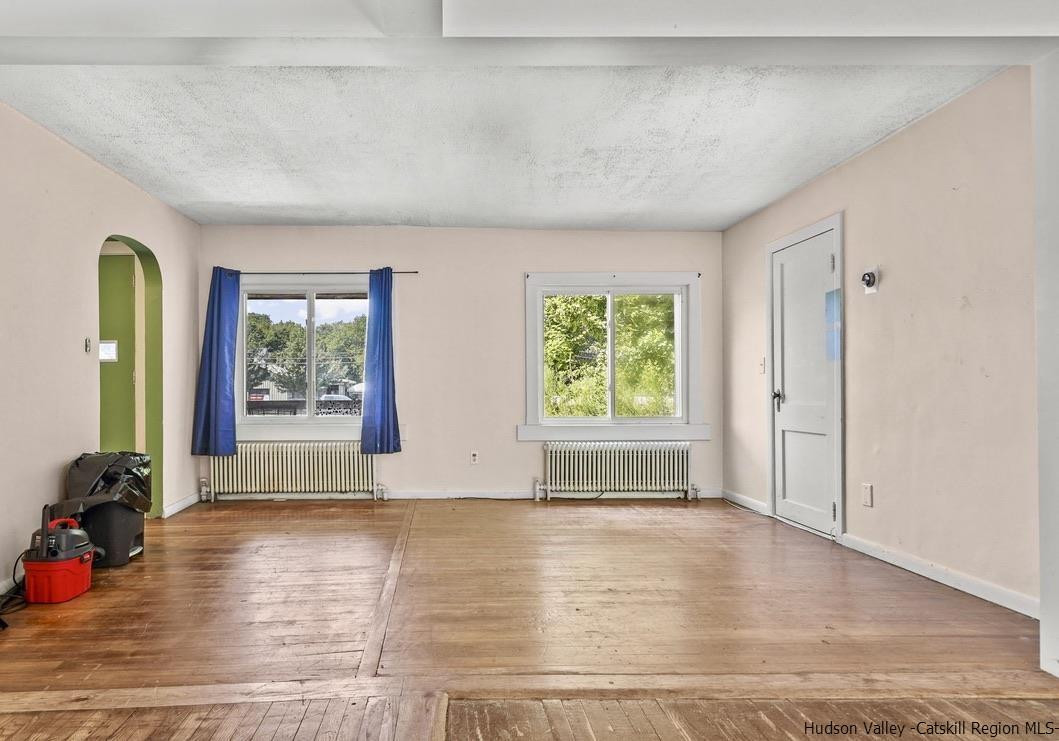 3603-3611 Main Street Stone Ridge, NY 12484 - Photo 21 of 28 an empty room with windows and closet