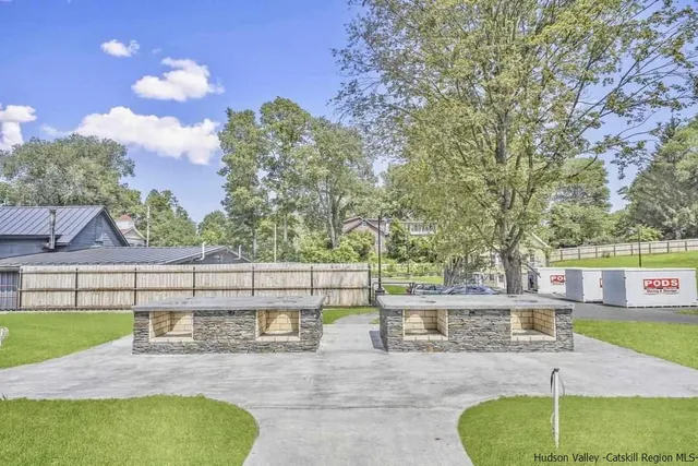 a view of a swimming pool with a patio