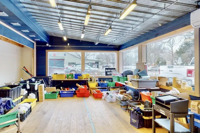 a living room filled with furniture and a dining table