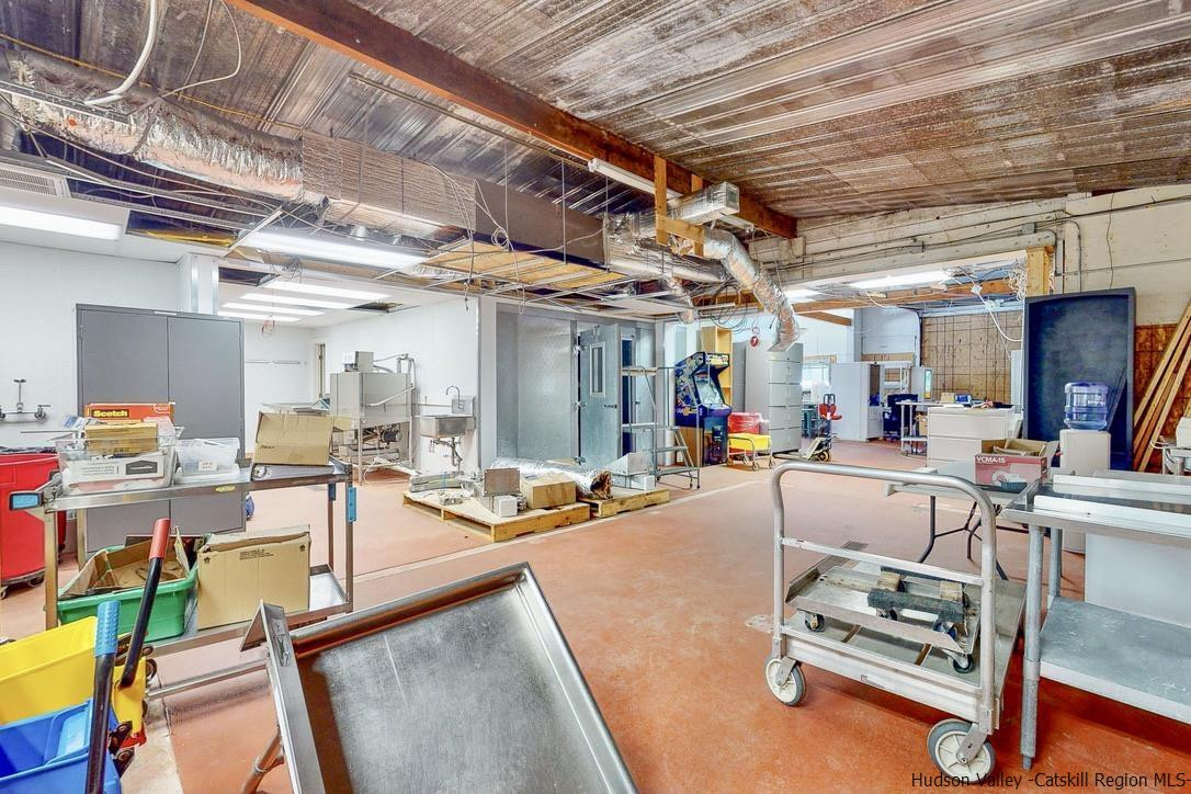 3603-3611 Main Street Stone Ridge, NY 12484 - Photo 7 of 28 a living room with lots of furniture and kitchen view