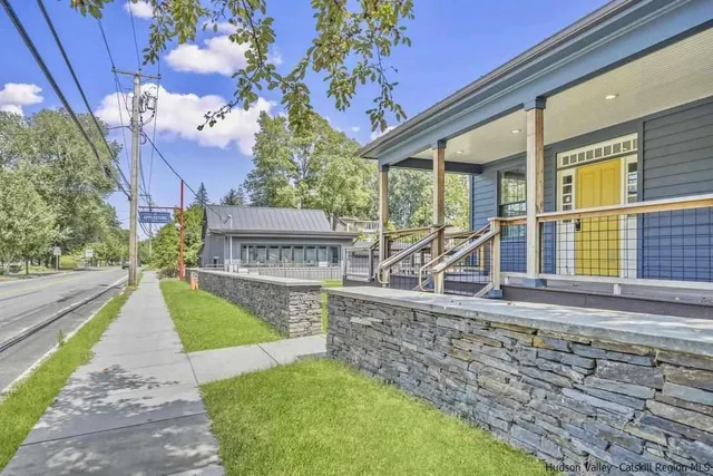 a view of a house with a backyard