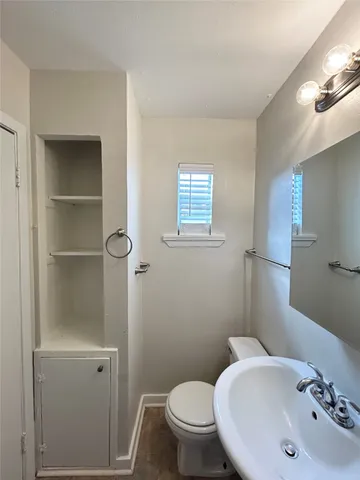 a bathroom with a sink and a toilet