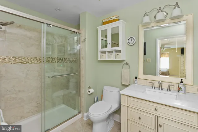 a bedroom that has a bed and a table in it