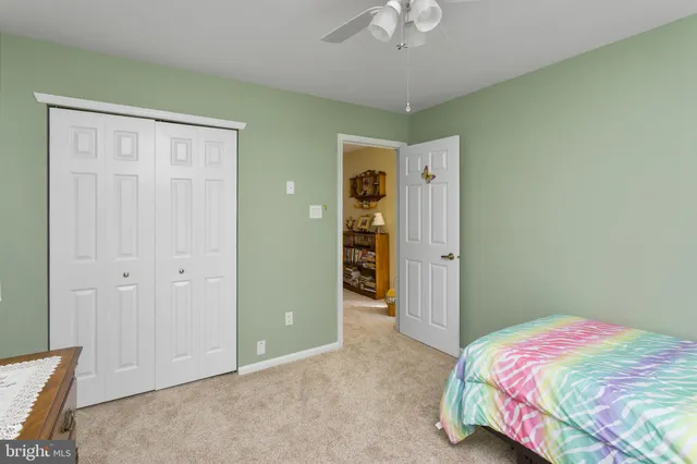 a bed room with a bed and a window