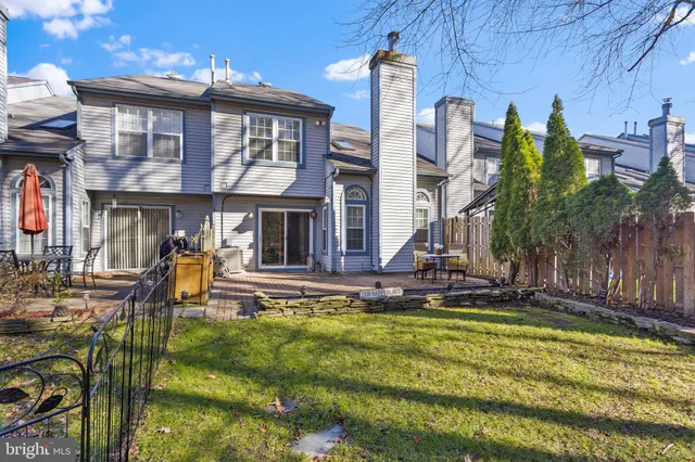 a front view of a house with swimming pool yard and outdoor seating