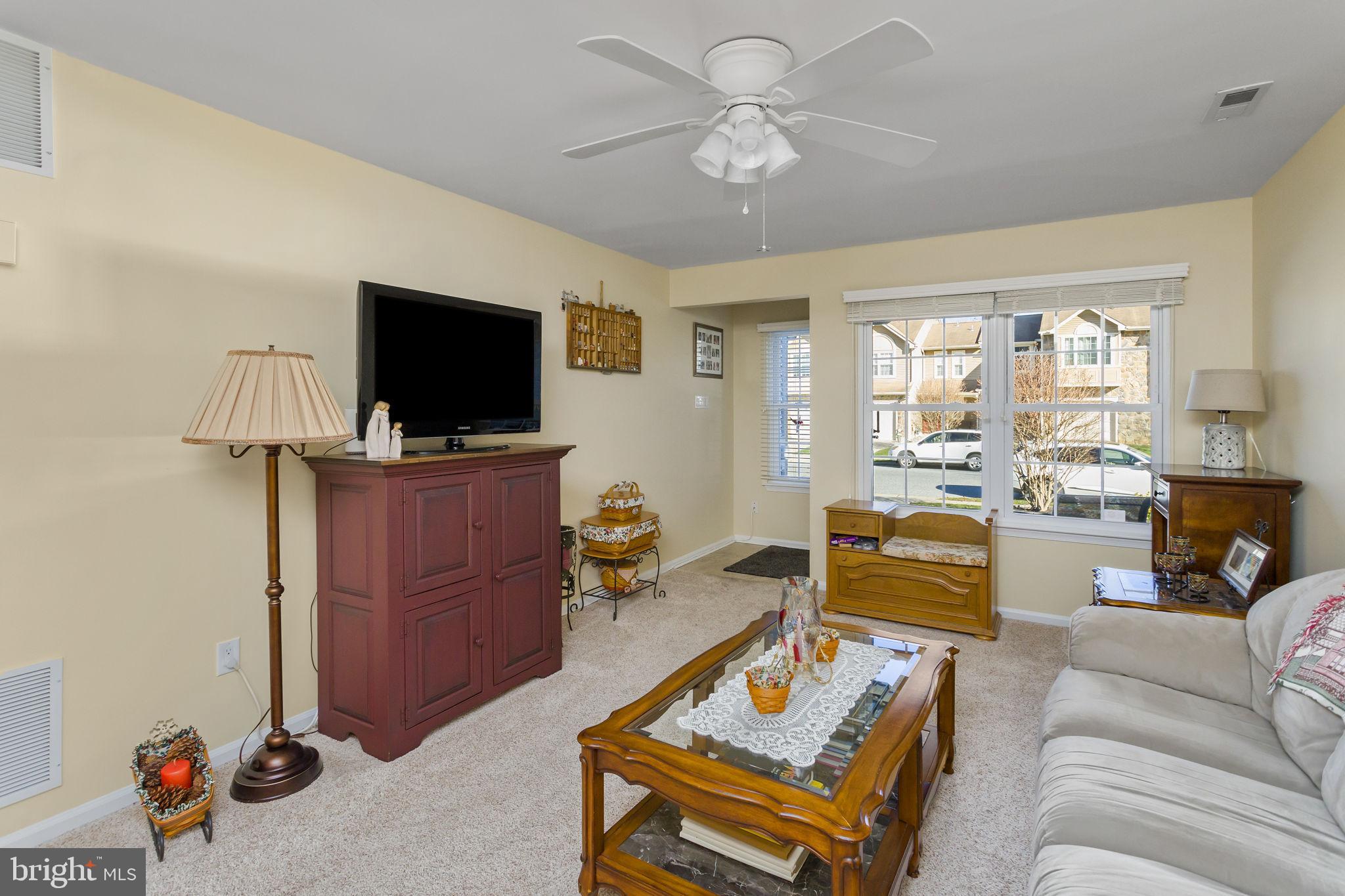 8 Kettlebrook Drive Mount Laurel, NJ 08054 - Photo 8 of 37 a living room with furniture and a flat screen tv