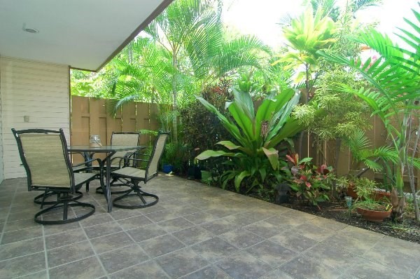 75-123 Lunapule Road, Unit 201 Kailua-Kona, HI 96740 - Photo 7 of 8 a view of a backyard with furniture and garden