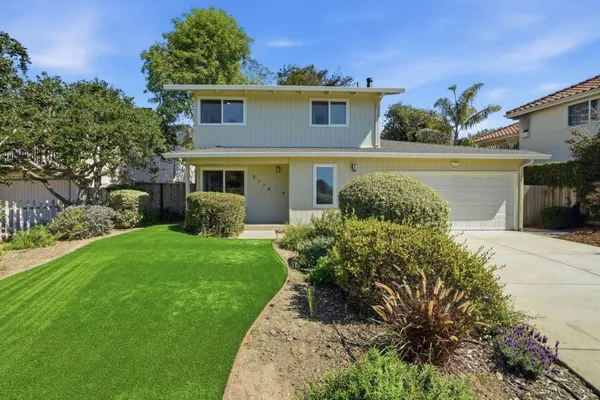 a view of a house with a garden