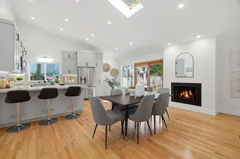 a kitchen with granite countertop a counter space a sink appliances and cabinets