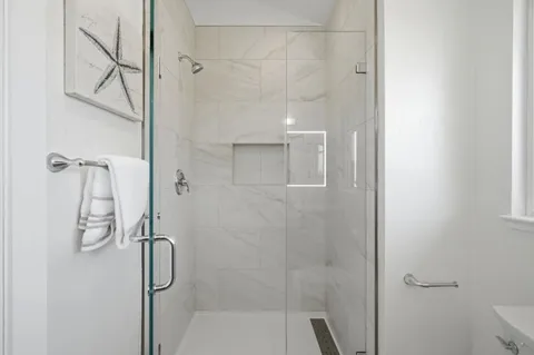 a bathroom with a bathtub and a shower