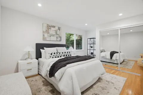 a view of a patio with table and chairs and potted plants