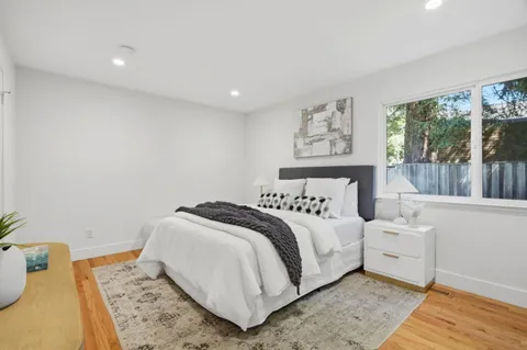 a view of a house with backyard and porch