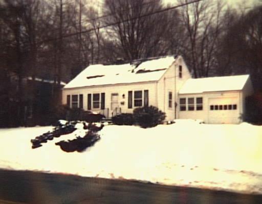 454 Welchs Point Road Milford, CT 06460 - Photo 1 of 1 a front view of a house with a yard covered with snow