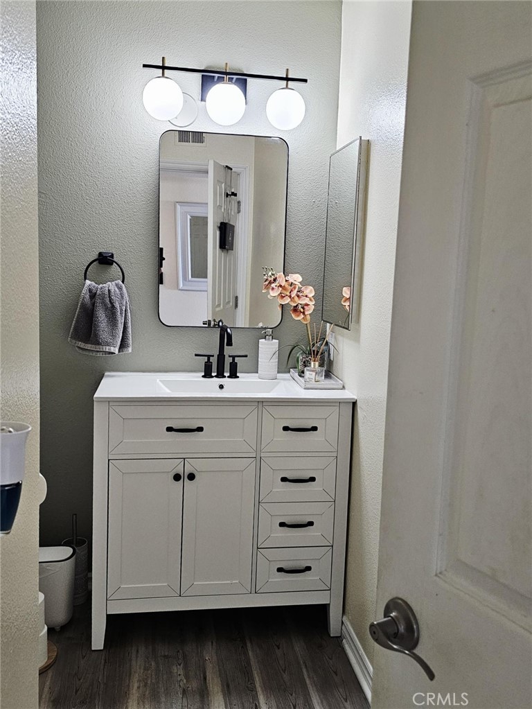 874 Cinnamon Lane Duarte, CA 91010 - Photo 14 of 32 a bathroom with a sink vanity and mirror