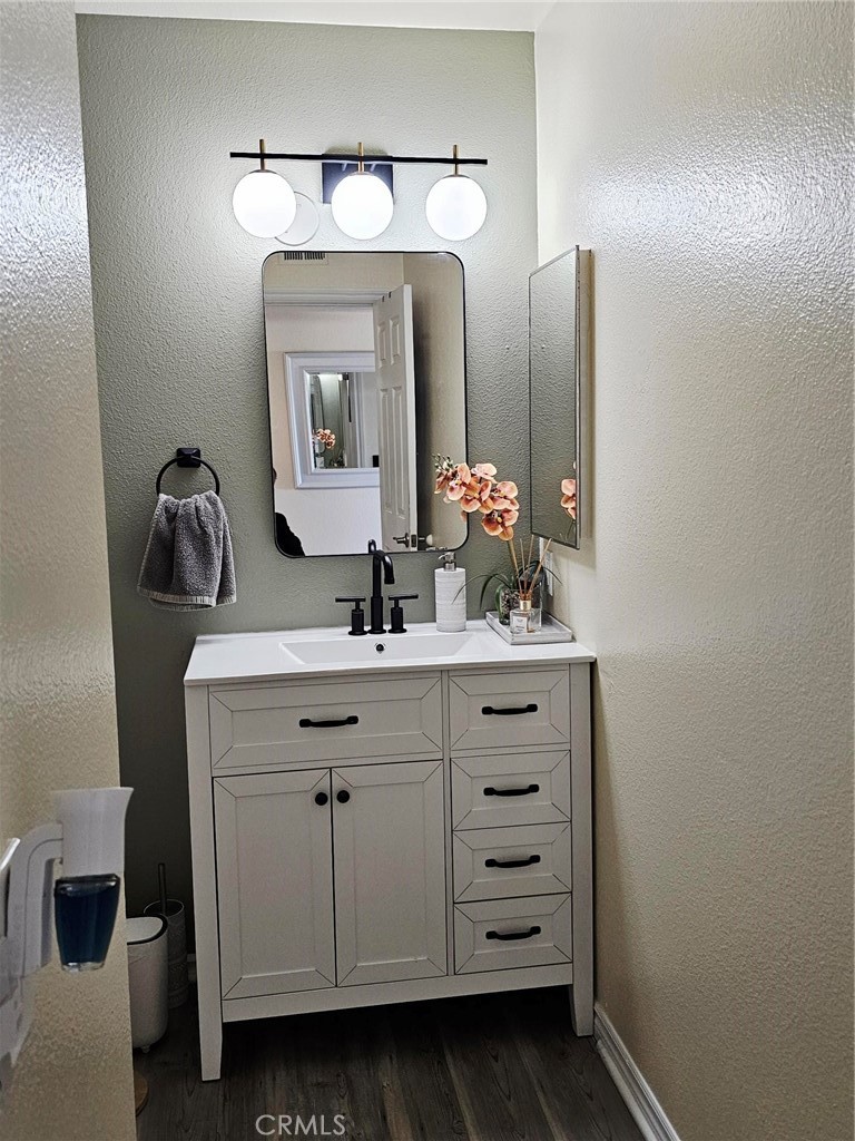 874 Cinnamon Lane Duarte, CA 91010 - Photo 16 of 32 a bathroom with a sink vanity and mirror