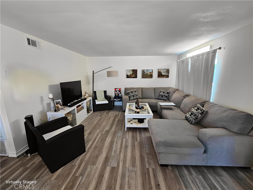 874 Cinnamon Lane Duarte, CA 91010 - Photo 3 of 32 a living room with furniture and a flat screen tv