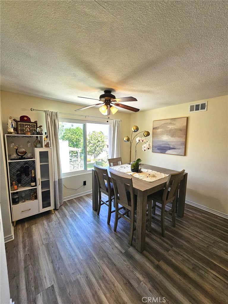 874 Cinnamon Lane Duarte, CA 91010 - Photo 8 of 32 a view of a dining room with furniture window and wooden floor