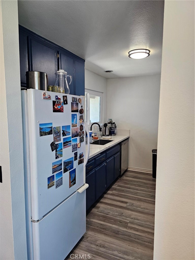 874 Cinnamon Lane Duarte, CA 91010 - Photo 10 of 32 a kitchen with stainless steel appliances a refrigerator and wooden cabinets