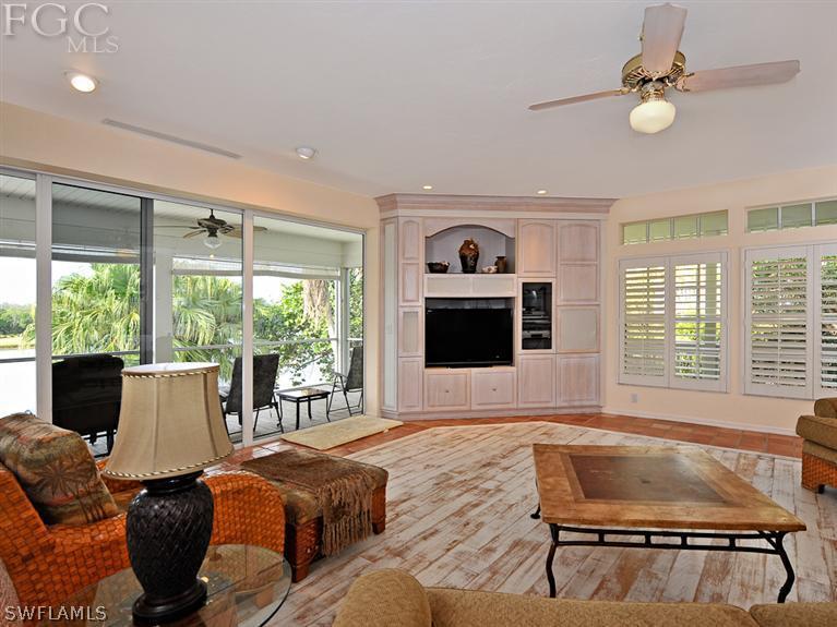 1566 Sand Castle Road Sanibel, FL 33957 - Photo 5 of 20 a living room with furniture and a flat screen tv
